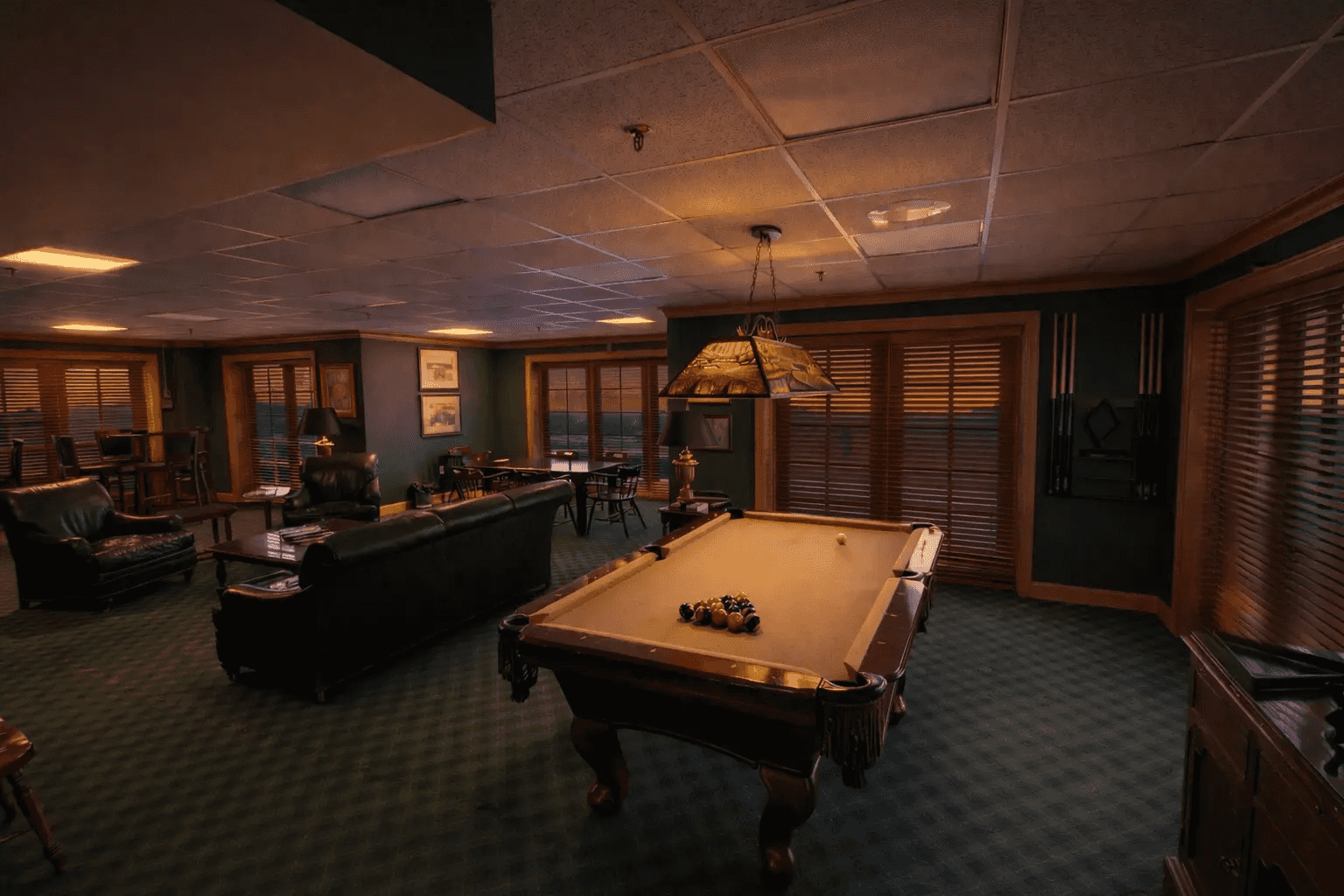 Image of a gym mirror with a bench press, treadmill, dumbbells, and kettlebells. 